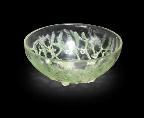 Gui, an R. Lalique green stained bowl, circa 1920s, the underside moulded with a radiating design of mistletoe boughs, the le