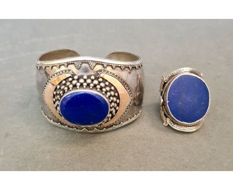 A bracelet marked 925 with blue insert, together with similar ring in white metal but unmarked 