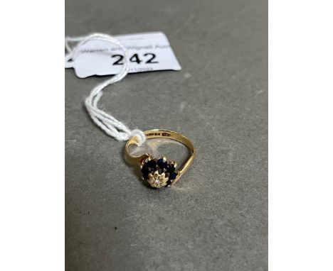 A 9ct gold sapphire and diamond ring. 