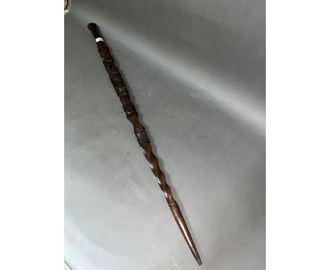 An African carved hardwood walking stick, length 100cm. 