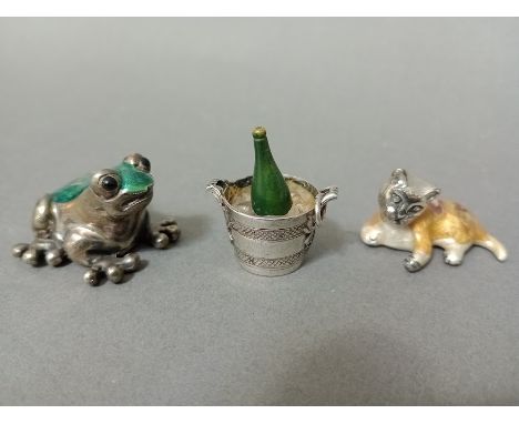 A silver and green enamel frog, marked 925 together with a silver and enamel cat and a silver charm / pendant in shape of cha