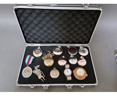 An aluminium case containing various pocket watches, etc. 