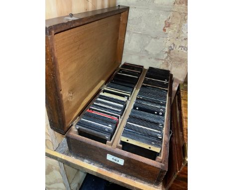 A case containing approx. 200+ early 20th century magic lantern type slides. 