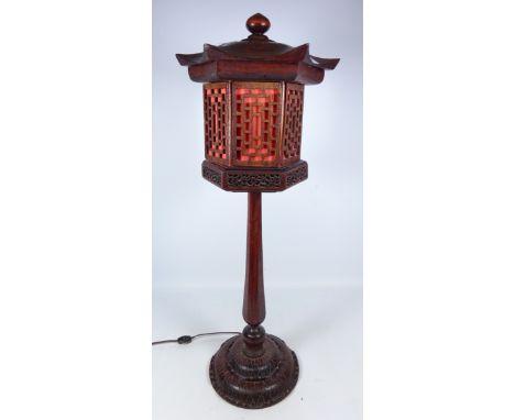 Oriental style hardwood table lamp, the shade in the form of a Pagoda, H74cm    Condition Report   Click here for further ima