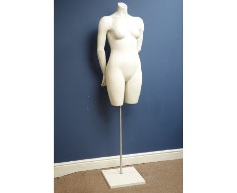 Half female adjustable mannequin on stand