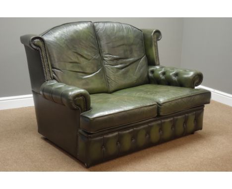 Two seat wingback sofa upholstered in buttoned green leather, W133cm   Condition Report   Click here for further images, cond