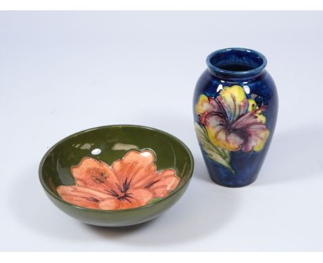 Small Moorcroft Lily pattern vase on blue ground, H10.5cm and a Moorcroft Lily pattern circular dish on green ground (2)   Co