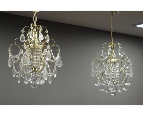 Pair of brass effect chandeliers with cut glass drops, two modern centre light fittings and other light fittings (9)   Condit