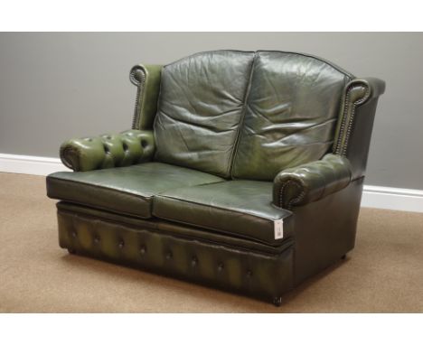 Two seat wingback sofa upholstered in buttoned green leather, W133cm   Condition Report   Click here for further images, cond