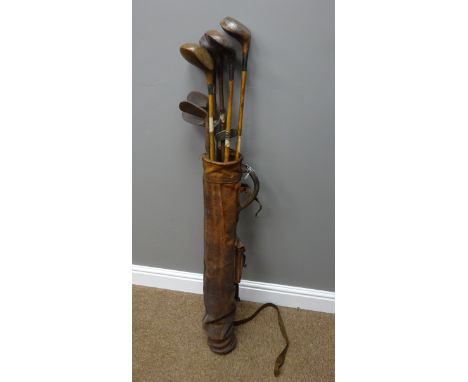 Collection of vintage hickory shafted gold clubs in vintage leather gold bag    Condition Report   Click here for further ima