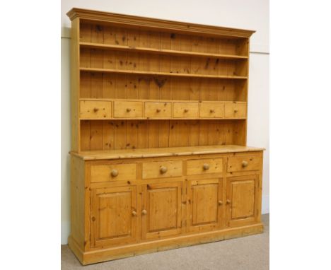 Solid pine kitchen dresser, four drawers and four cupboards, raised three tier plate rack with spice drawers, W203cm, H220cm,