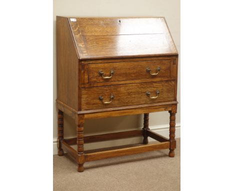 Early 20th century medium oak bureau, fall front above two drawers, bobbin turned supports, W76cm, H99cm, D41cm   Condition R