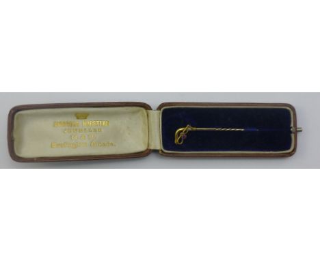 A 15 ct gold ruby set riding crop stickpin