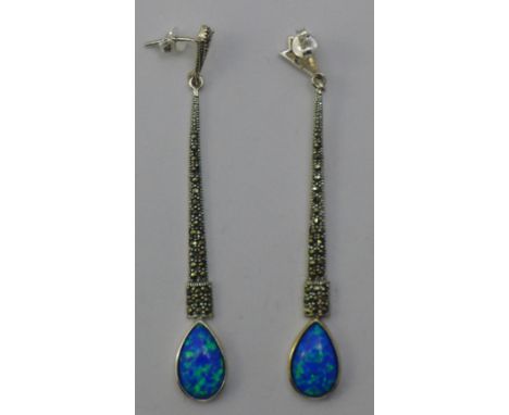 A pair of silver and opal earrings