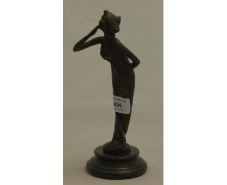 A small Art Nouveau style bronze figure of a girl