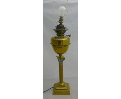 A brass oil lamp and another