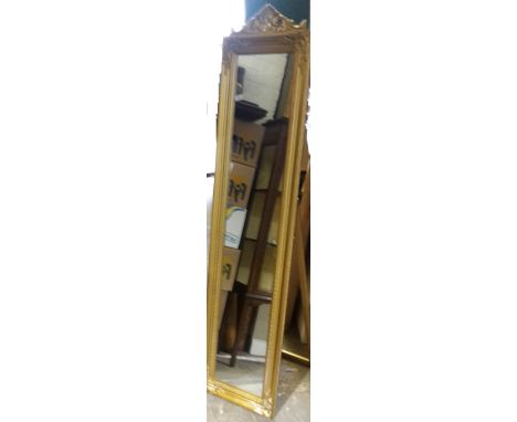 A gold cheval mirror