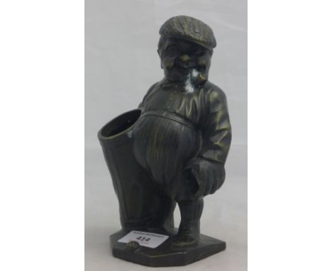 A bronze figure of a golfer