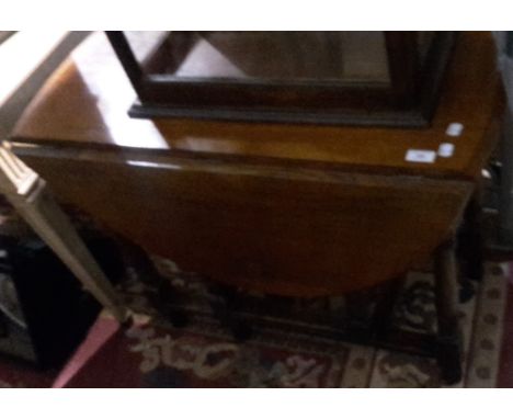 An early 20th century oak gate leg table