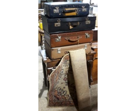 Four vintage cases and a rug