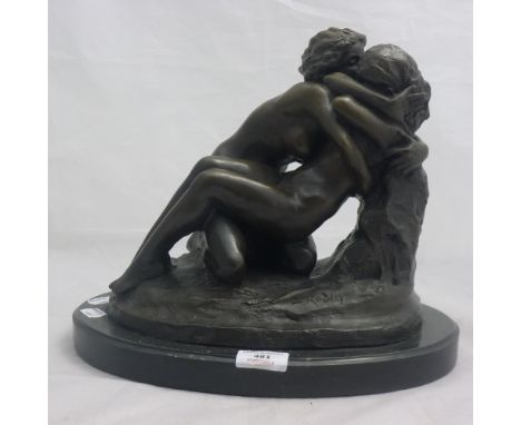 A bronze figure of lesbian lovers