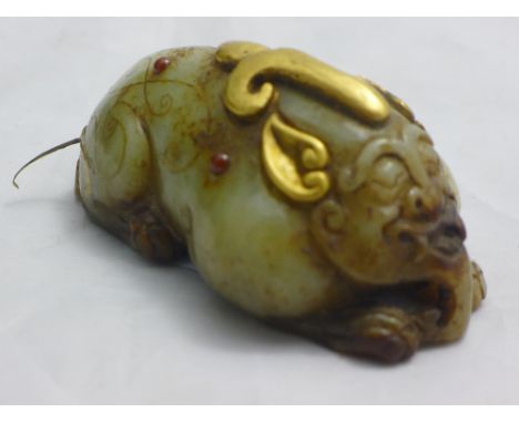A Chinese gilt heightened jade mythical beast