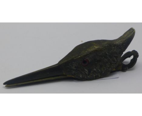 A bronze letter clip in the form of a bird