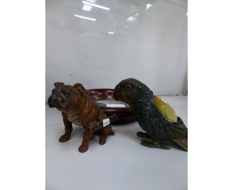 A SPELTER PARROT PIN CUSHION, A SPELTER BULLDOG MATCH STRIKE, AND A MAHOGANY FRAMED BRASS CLASSICAL BUST. 