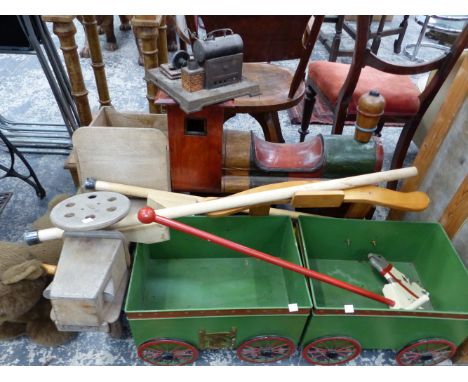 A WOODEN ROCKING TRAIN, A HOBBY HORSE, STILTS, A STEAM ENGINE AND OTHER TOYS.