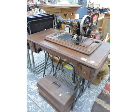 A VINTAGE KILDALE TREADLE SEWING MACHINE.