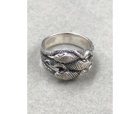 A SILVER TRIPLE COILED SERPENT RING FINGER SIZE V.