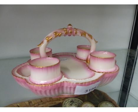A ROYAL WORCESTER BLUSH PINK EGG CUP CRUET. 