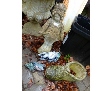 A GARDEN FIGURE OF A YOUNG GIRL TOGETHER WITH A PLANT POT IN THE FORM OF A BOOT AND TWO PAINTED BIRD WALL PLAQUES.