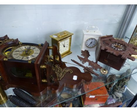 A DUTCH STYLE WALL CLOCK, A CUCKOO CLOCK, AND FOUR MANTLE CLOCKS.