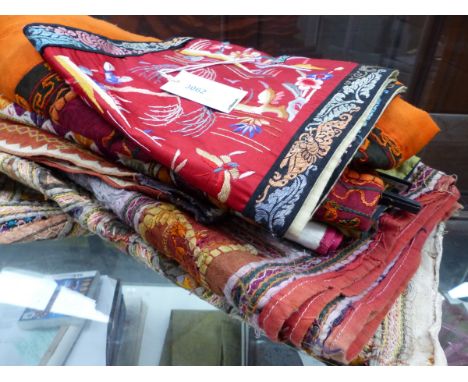 A SMALL COLLECTION OF EASTERN AND ORIENTAL TEXTILES.