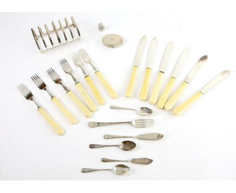 George V silver toast rack, by Mappin and Webb, Birmingham 1931, 11.5 cm wide, together with a set of six fish knives and for