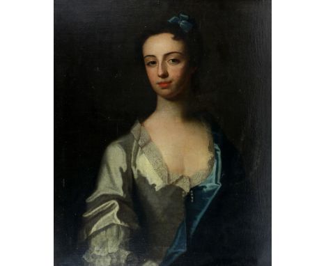 Late 18th/early 19th century portrait of a young women in a blue dress over one shoulder  with pearl clasp  unsigned oil on c