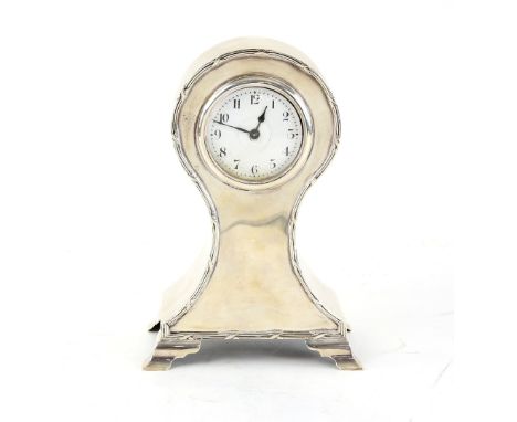 Edward VII silver balloon clock with ribbon-tie border on four ogee bracket feet, by William Comyns &amp; Sons, London, 1902,