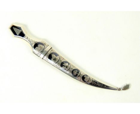 Egyptian-style niello white-metal letter opener, designed as a dagger, decorated with engraved niello roundels depicting boat
