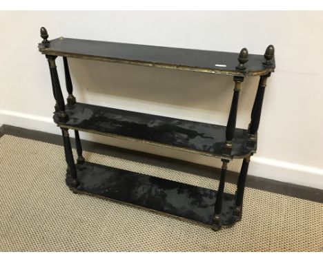 A 19th Century ebonised and gilt decorated three tier wall shelf, 66 cm wide x 16.5 cm deep x 57.5 cm high, together with an 