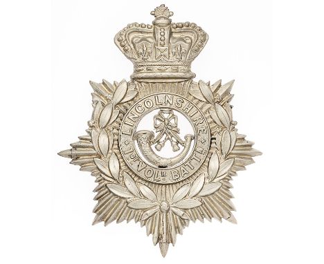 1st VB Lincolnshire Regiment Victorian helmet plate circa 1883-1901.   Good scarce die-stamped white metal crowned star beari