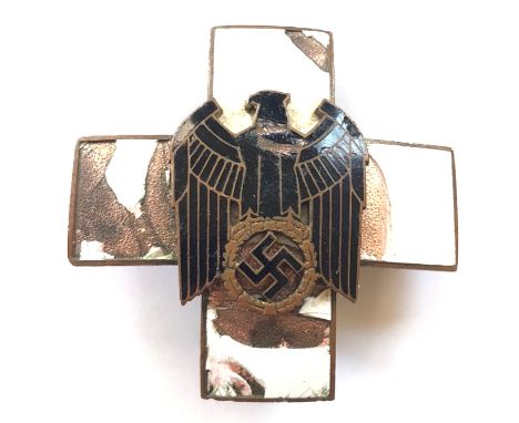 German Third Reich Social Welfare Organization Merit Cross.  A relic 2nd class breast award. White enamel cross with applied 