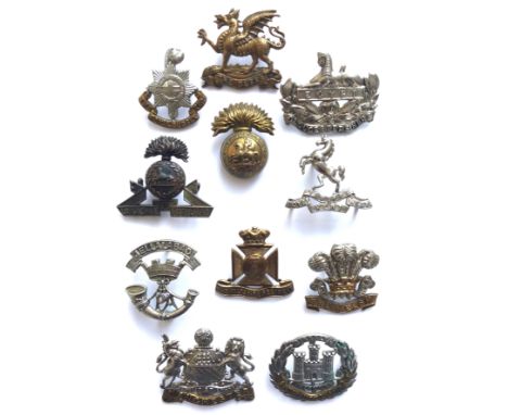 11 Victorian/Edwardian cap badges.  Royal Sussex ... Buffs ... Gloucester ... Lancashire Fusiliers ... Northumberland Fusilie
