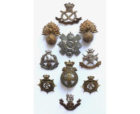 10 Victorian cap badges.  2 x Royal Fusiliers ... South Staffordshire ... East Lancashire ... Highland Light Infantry ... She