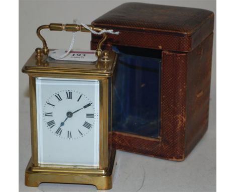 A lacquer brass carriage clock in outer leather carry case, circa 1900