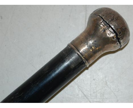 A late Victorian silver topped ebony walking cane, stamped 'Captain M Finn' to the top 
