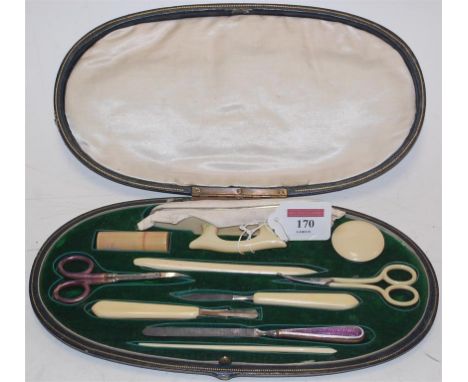 A cased lady's vanity set (some replaced tools)