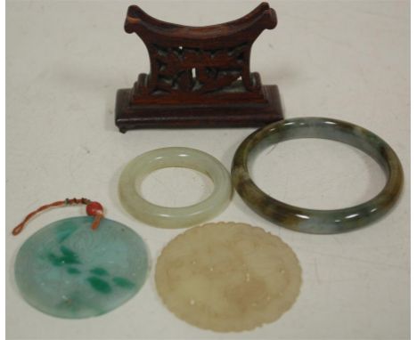 Jadeite to include two bangles and one pendant, and a faux jade pendant (4)