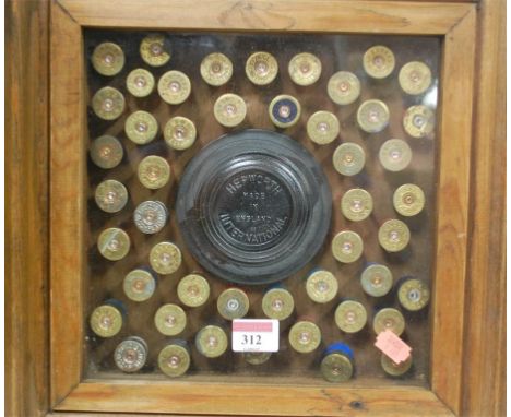 A framed shotgun and clay pigeon display; together with a leather cased camera tripod (2)