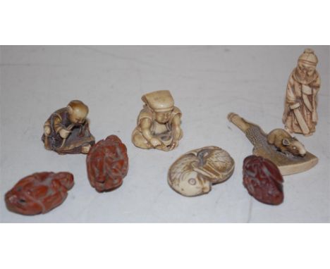 Assorted Japanese faux ivory and hardwood netsuke carvings